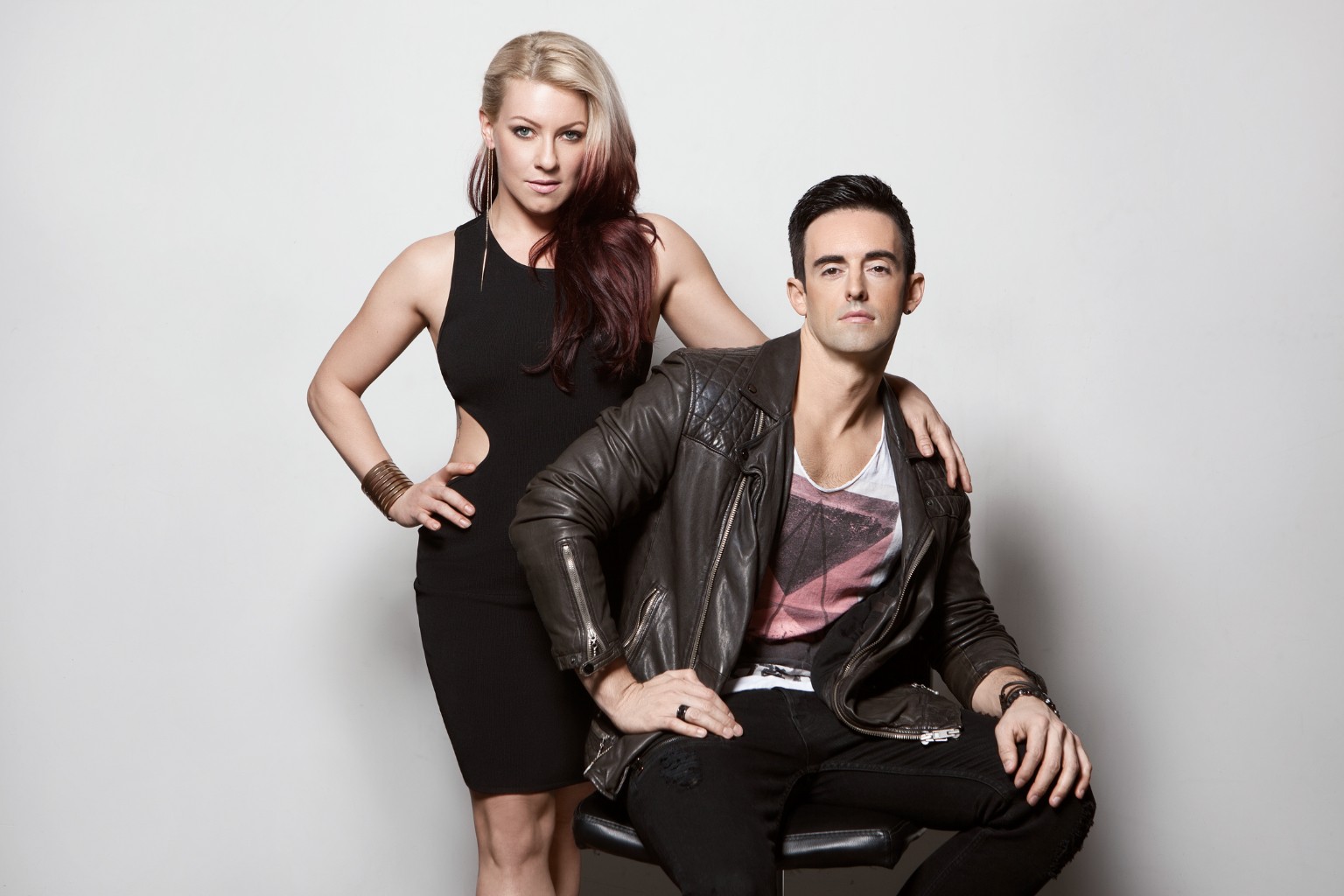 Tatiana standing beside Jordan in a studio portrait